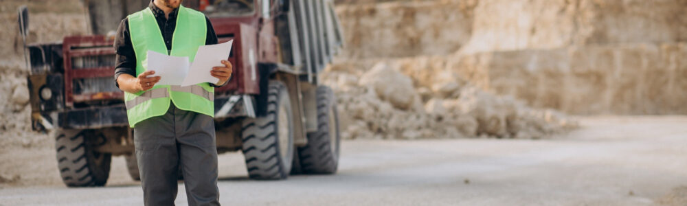 male-worker-with-bulldozer-in-sand-quarry male-worker-with-bulldozer-in-sand-quarry